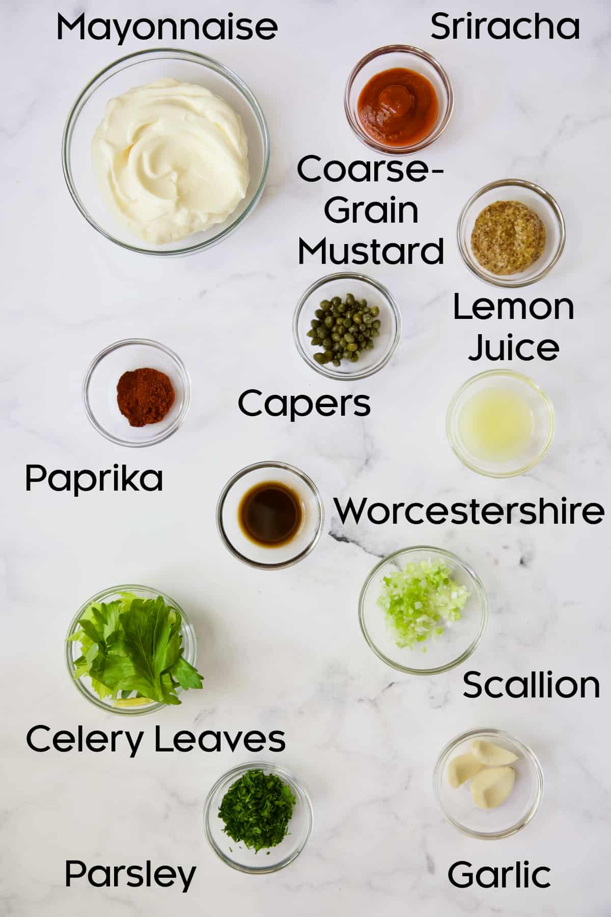 Photo of ingredients for Sriracha remoulade in glass bowls.