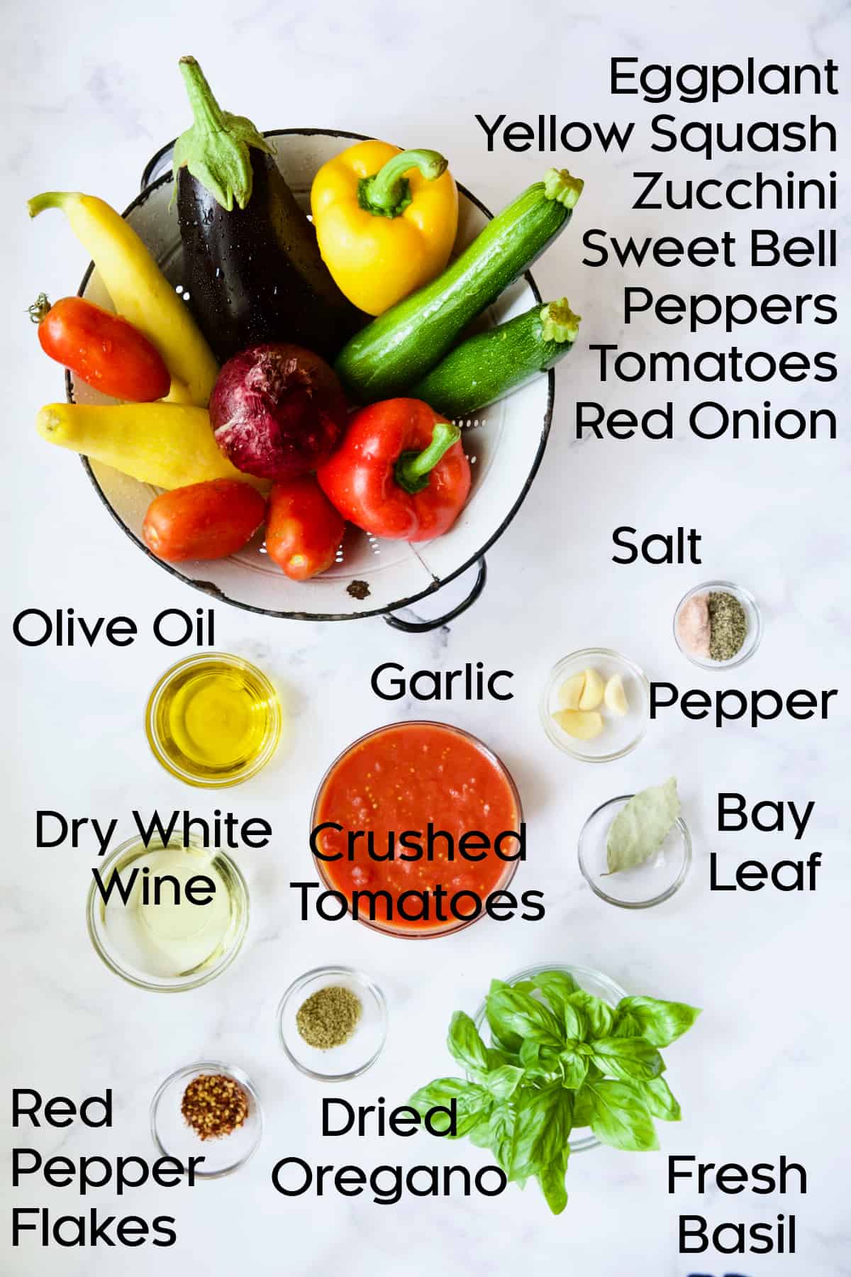 Ingredients for Classic French Ratatouille in glass bowls.