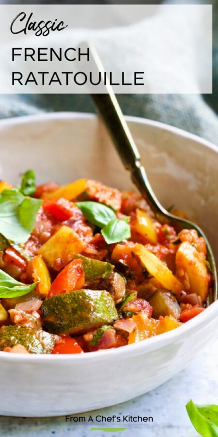Pinterest graphic for Classic French Ratatouille showing one serving in a white bowl with fork.