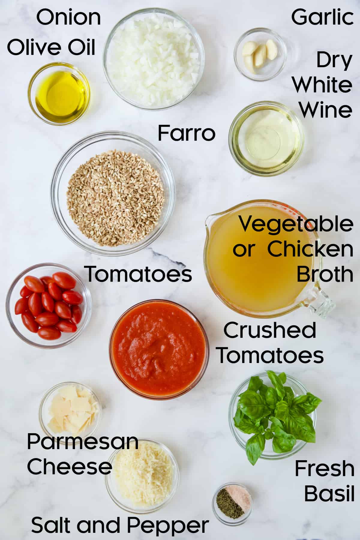 Ingredients for Tomato Farro Risotto with Basil and Parmesan in glass bowls.