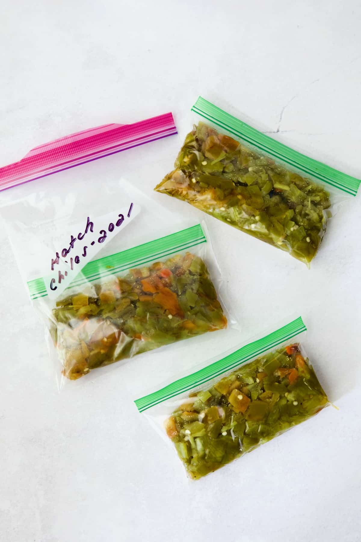 Diced, roasted Hatch green chiles in small freezer bags.