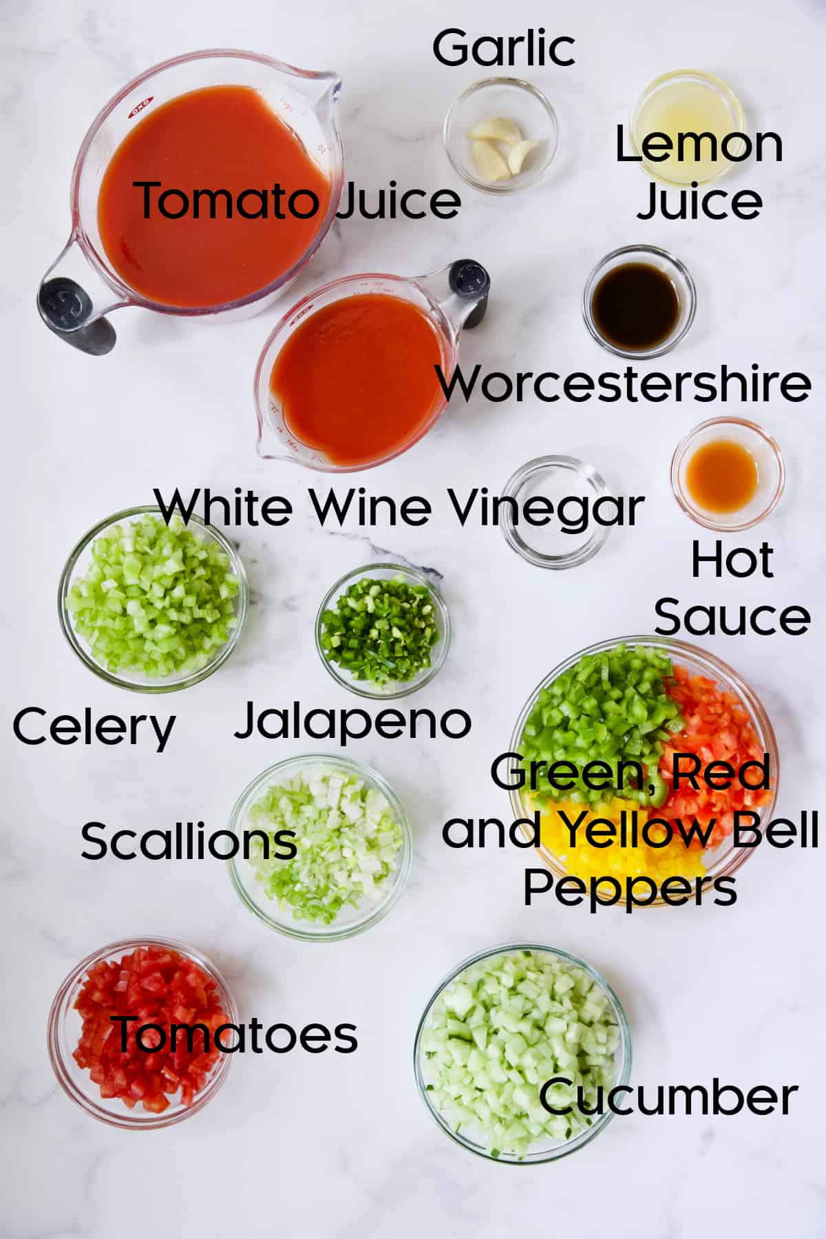 Ingredients for Very Veggie Gazpacho in glass bowls.