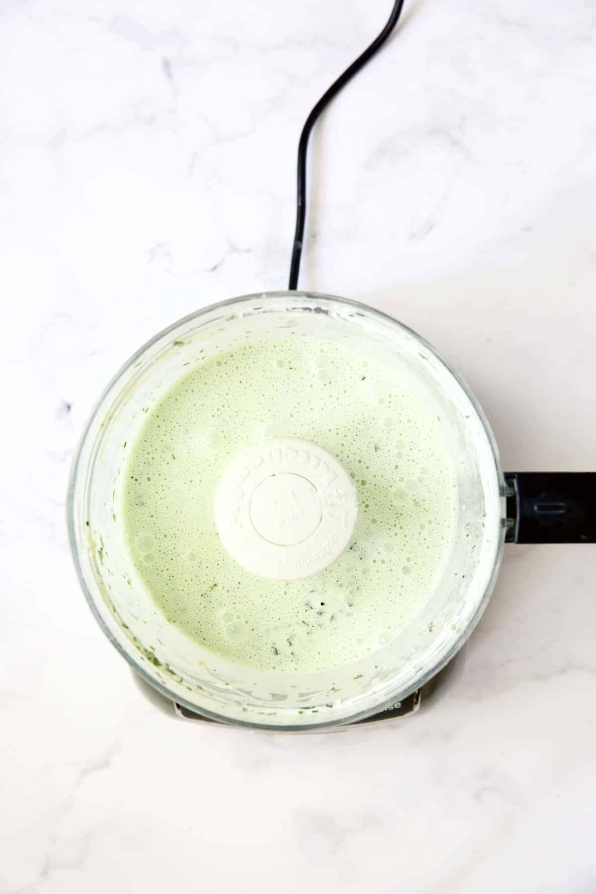 Basil Buttermilk Sauce in food processor.