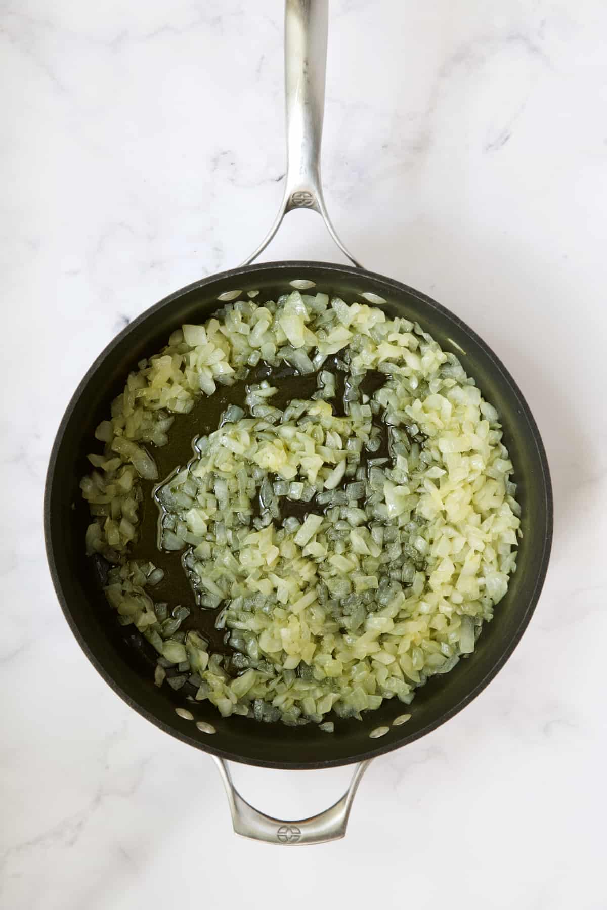 Cooked onions in skillet.