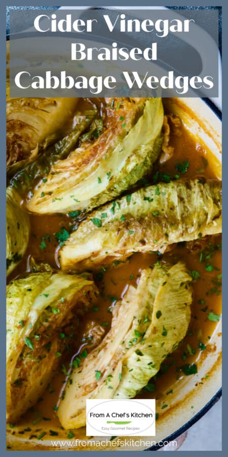 Six braised cabbage wedges in white enamel cast iron skillet.