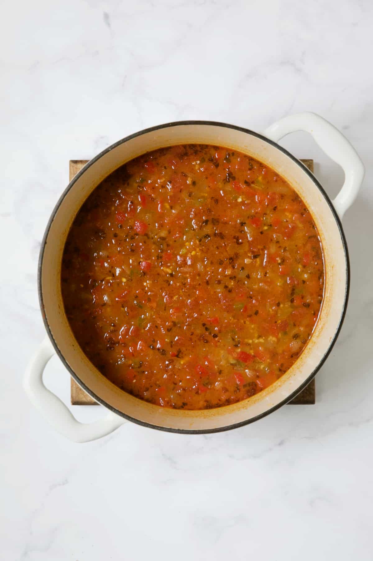 Soup in white Dutch oven.