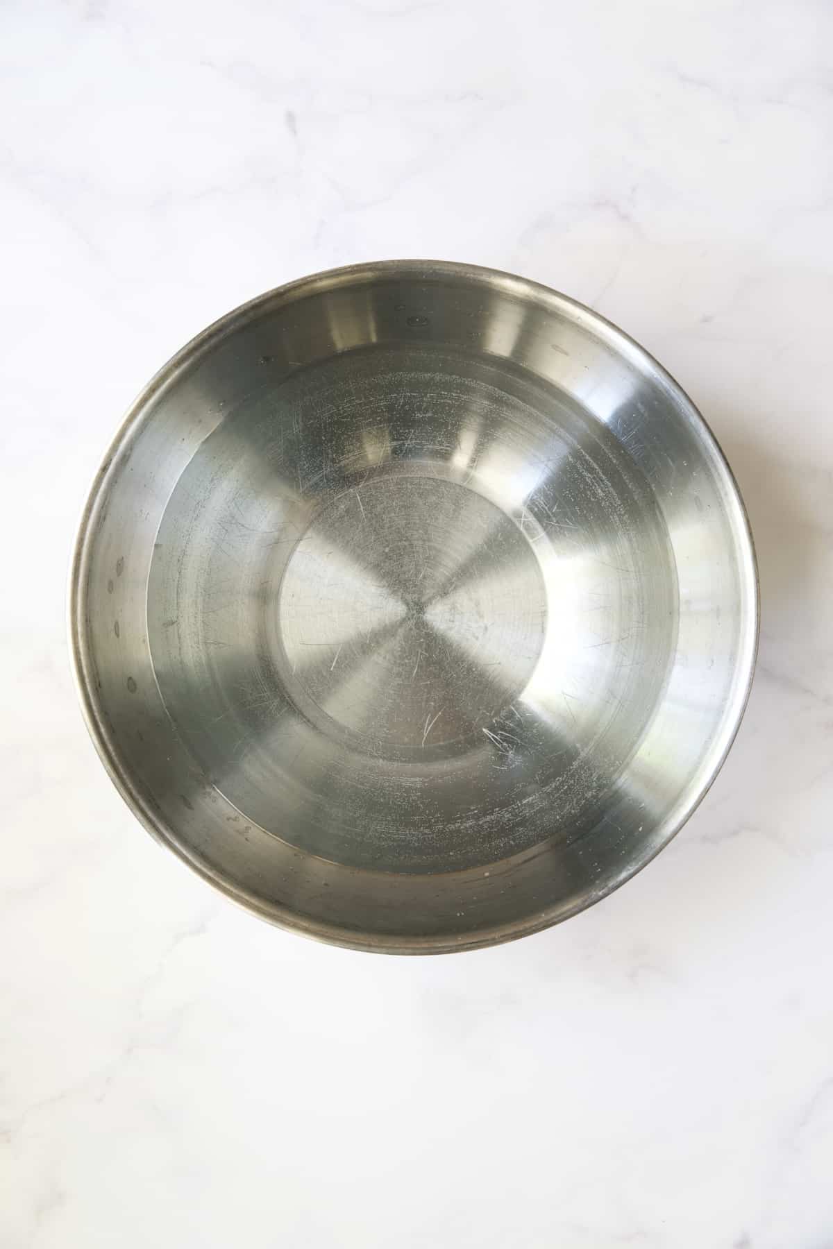 Water in stainless steel bowl.