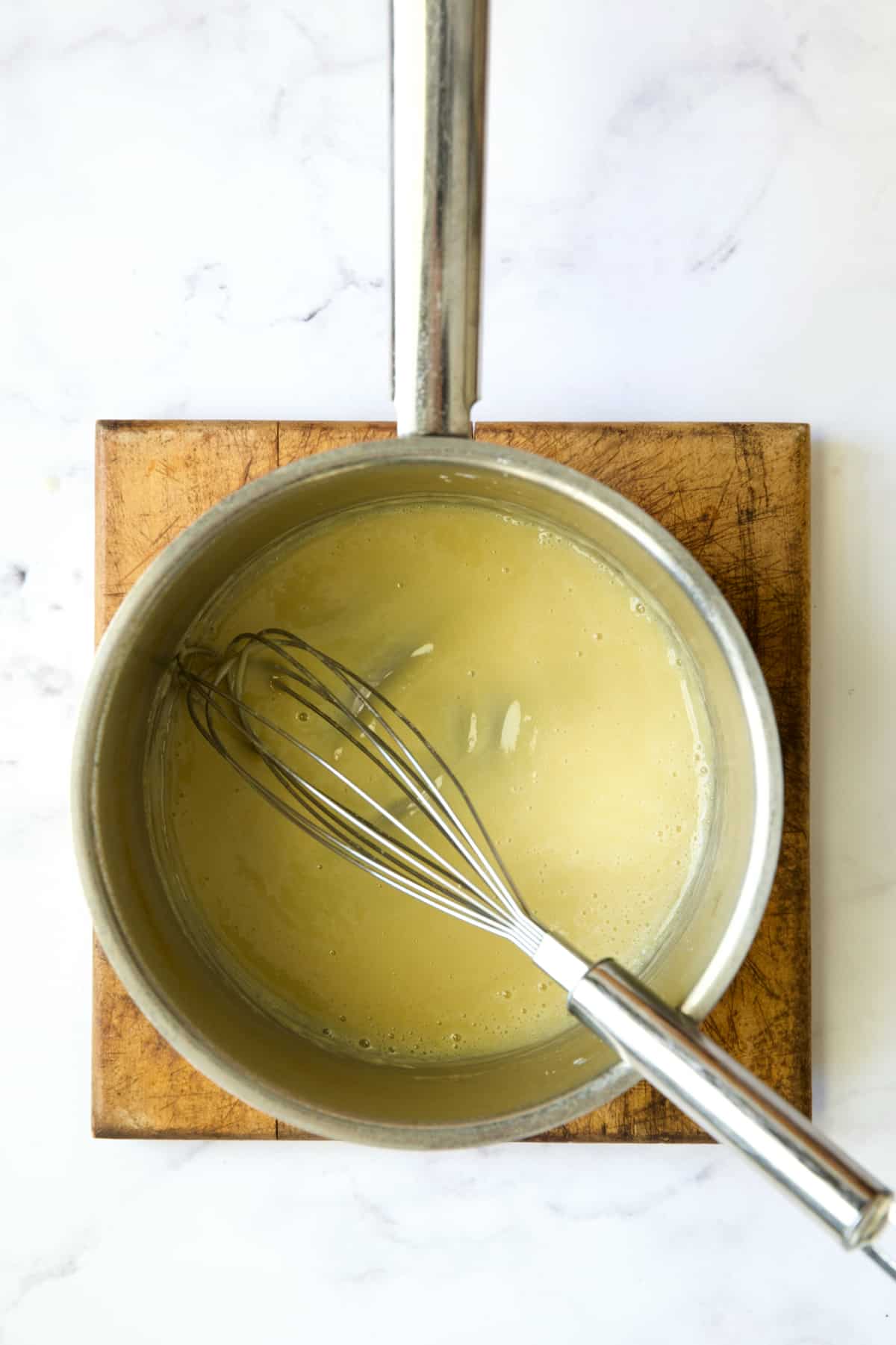 Whisk whisking butter and flour in stainless steel saucepan.