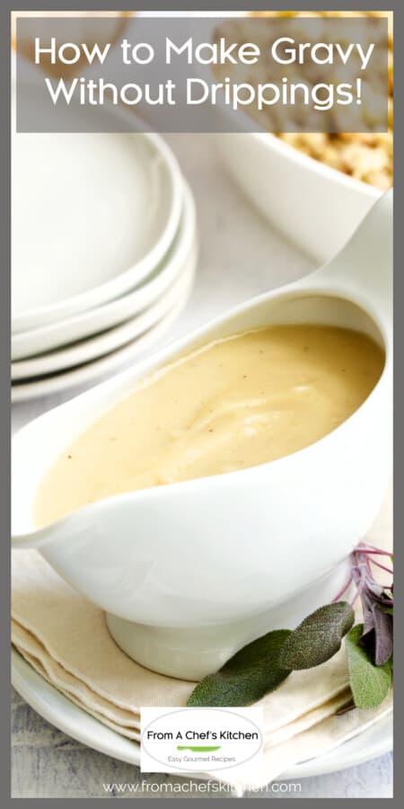 Chicken gravy in white gravy boat garnished with sage leaves.