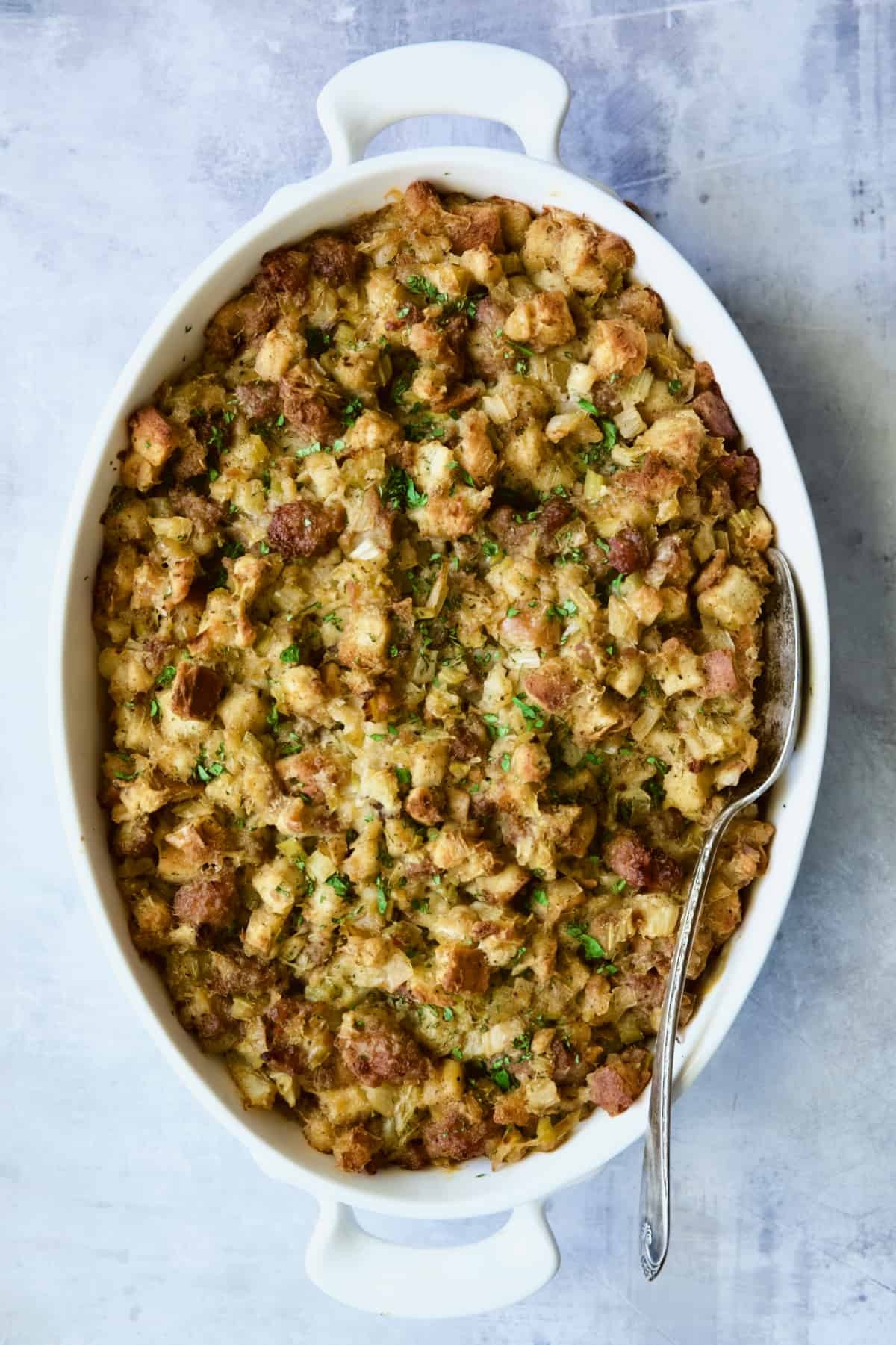 Sausage Stuffing with Fennel and Leeks on light blue background.