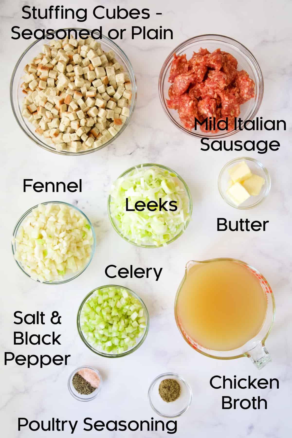 Ingredients for Sausage Stuffing with Fennel and Leeks in glass bowls.