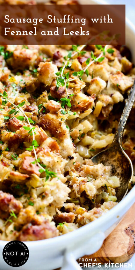 Pinterest graphic for Sausage Stuffing with Fennel and Leeks showing it in a white baking dish with serving spoon.