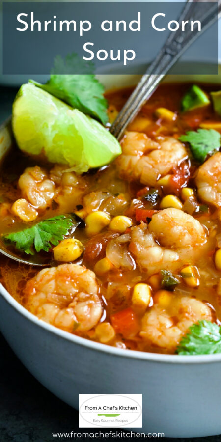 Pinterest graphic for Shrimp and Corn Soup showing it in a white bowl with soup spoon garnished with lime wedge and cilantro.