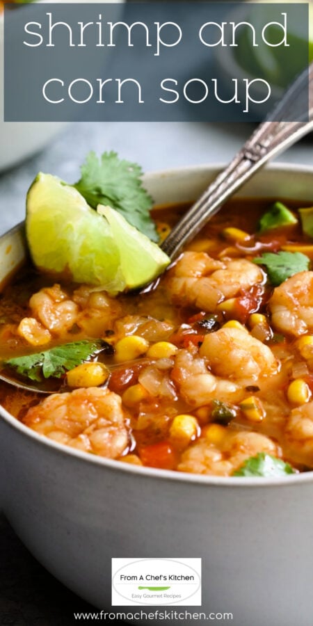 Pinterest graphic for Shrimp and Corn Soup showing it in a white bowl with soup spoon garnished with cilantro and lime wedge.