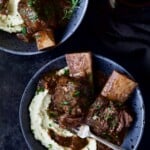 Two bowls of Braised Beef Short Ribs with Cauliflower Leek Puree.