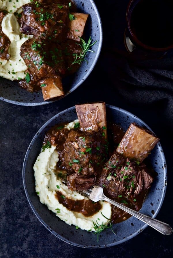 Two bowls of Braised Beef Short Ribs with Cauliflower Leek Puree.