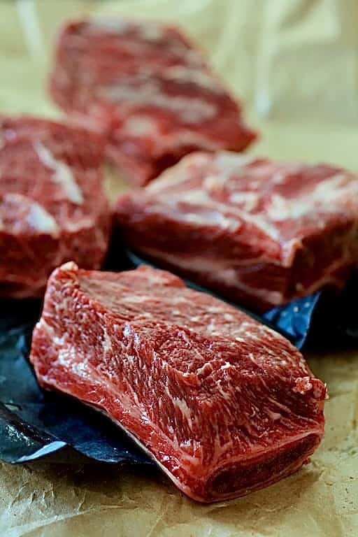 Beef short ribs on butcher paper.