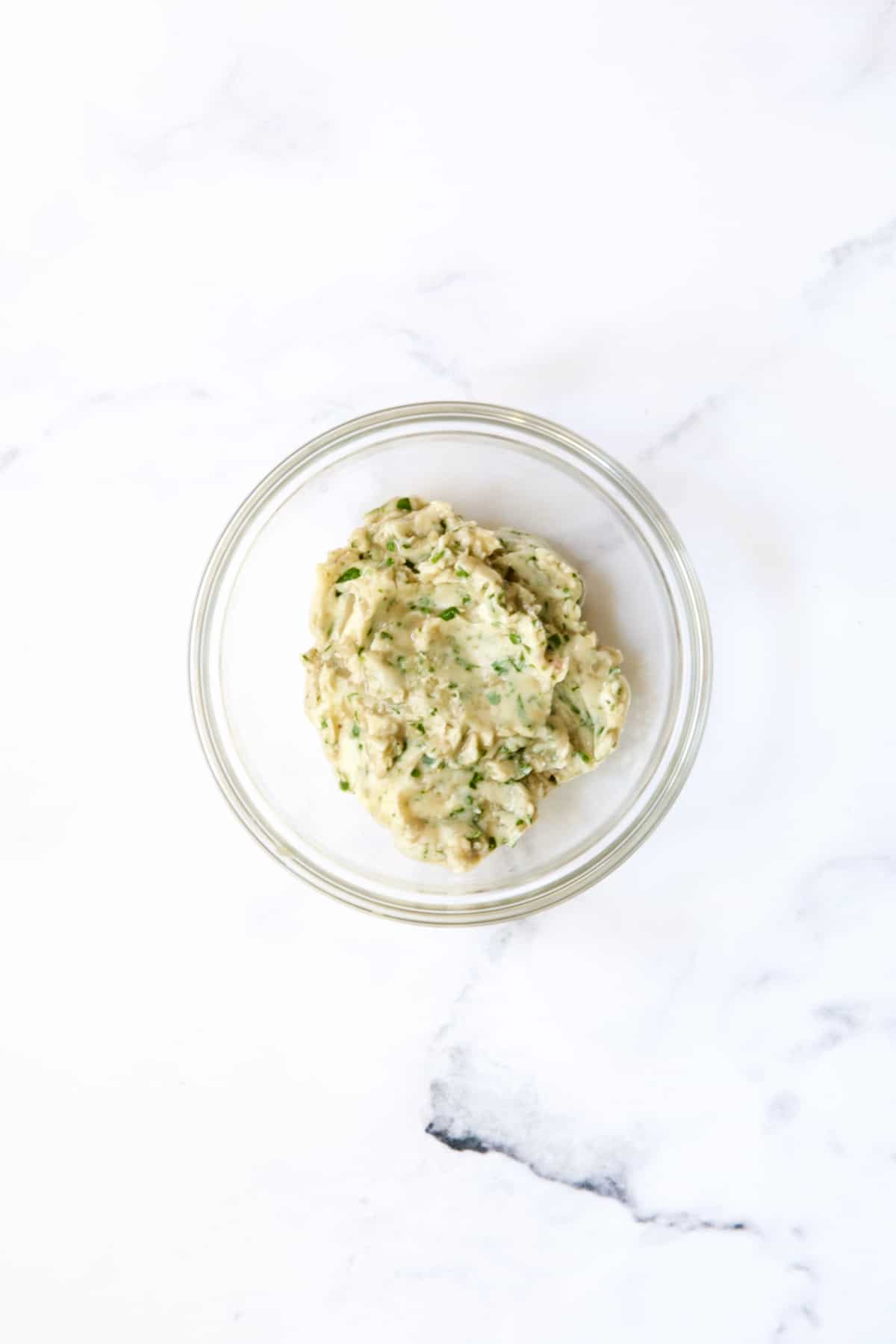 Anchovy butter in glass bowl.
