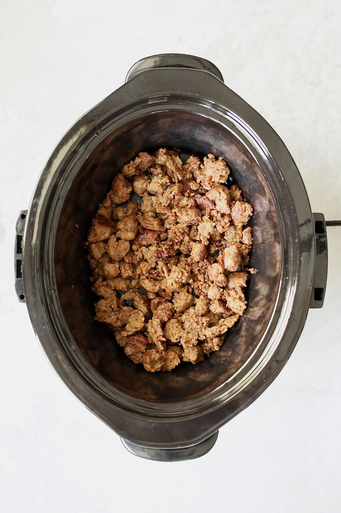 Cooked Italian sausage in slow cooker.