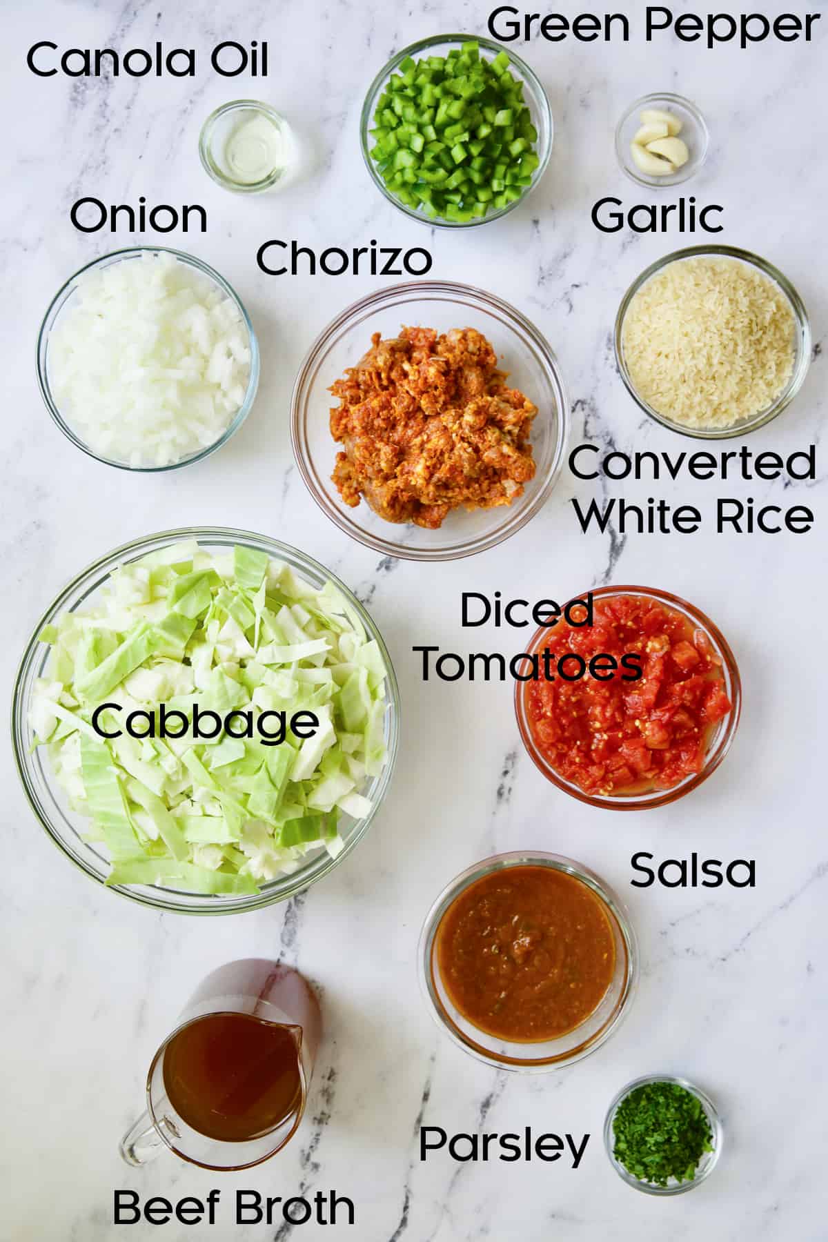 Ingredients for Unstuffed Chorizo Cabbage Roll Skillet in glass bowls.