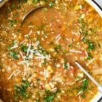 Vegetable Barley Soup in white Dutch oven.