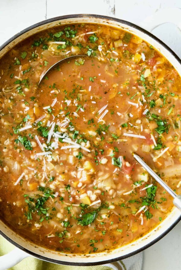 Vegetable Barley Soup in white Dutch oven.