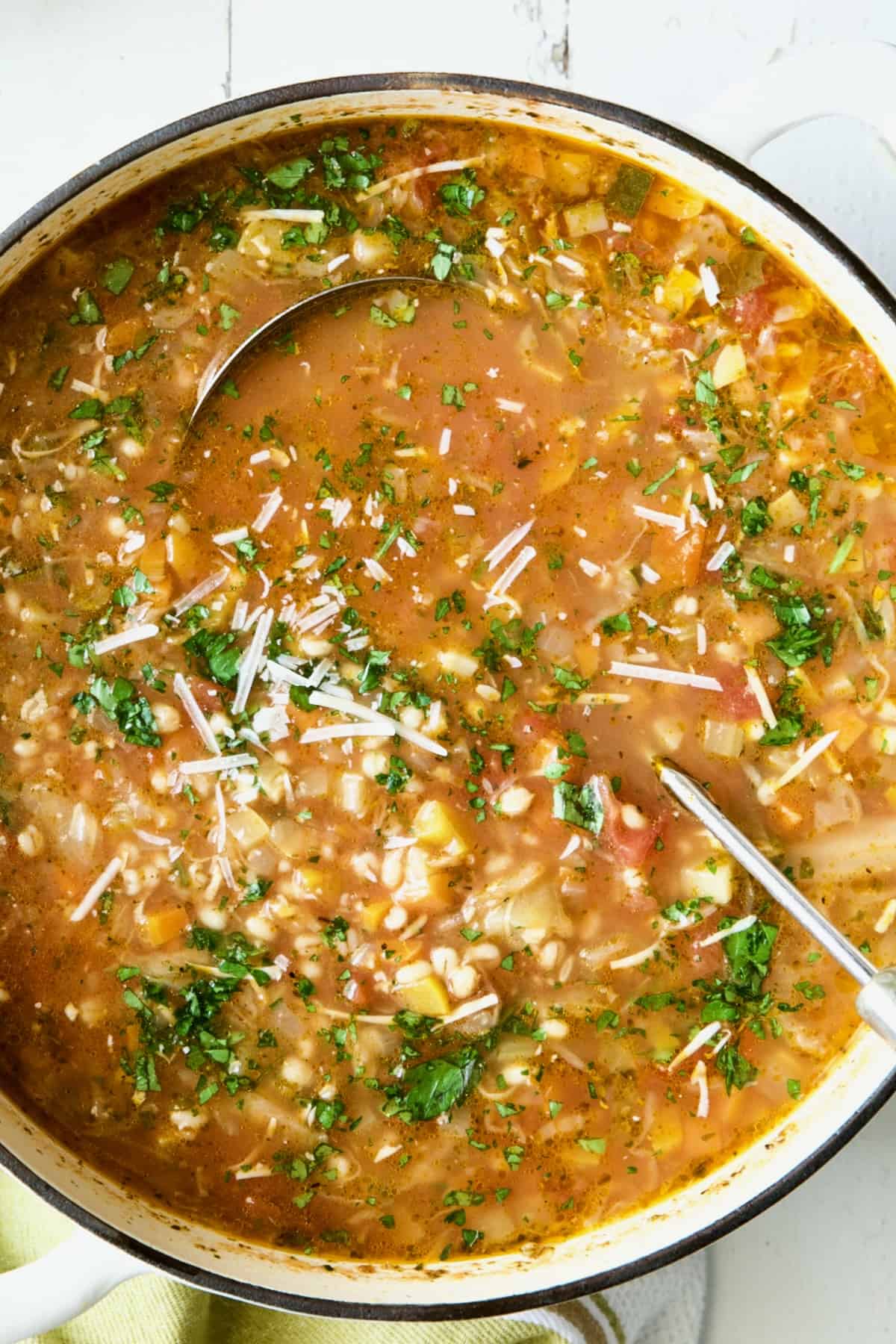 Vegetable Barley Soup in white Dutch oven.