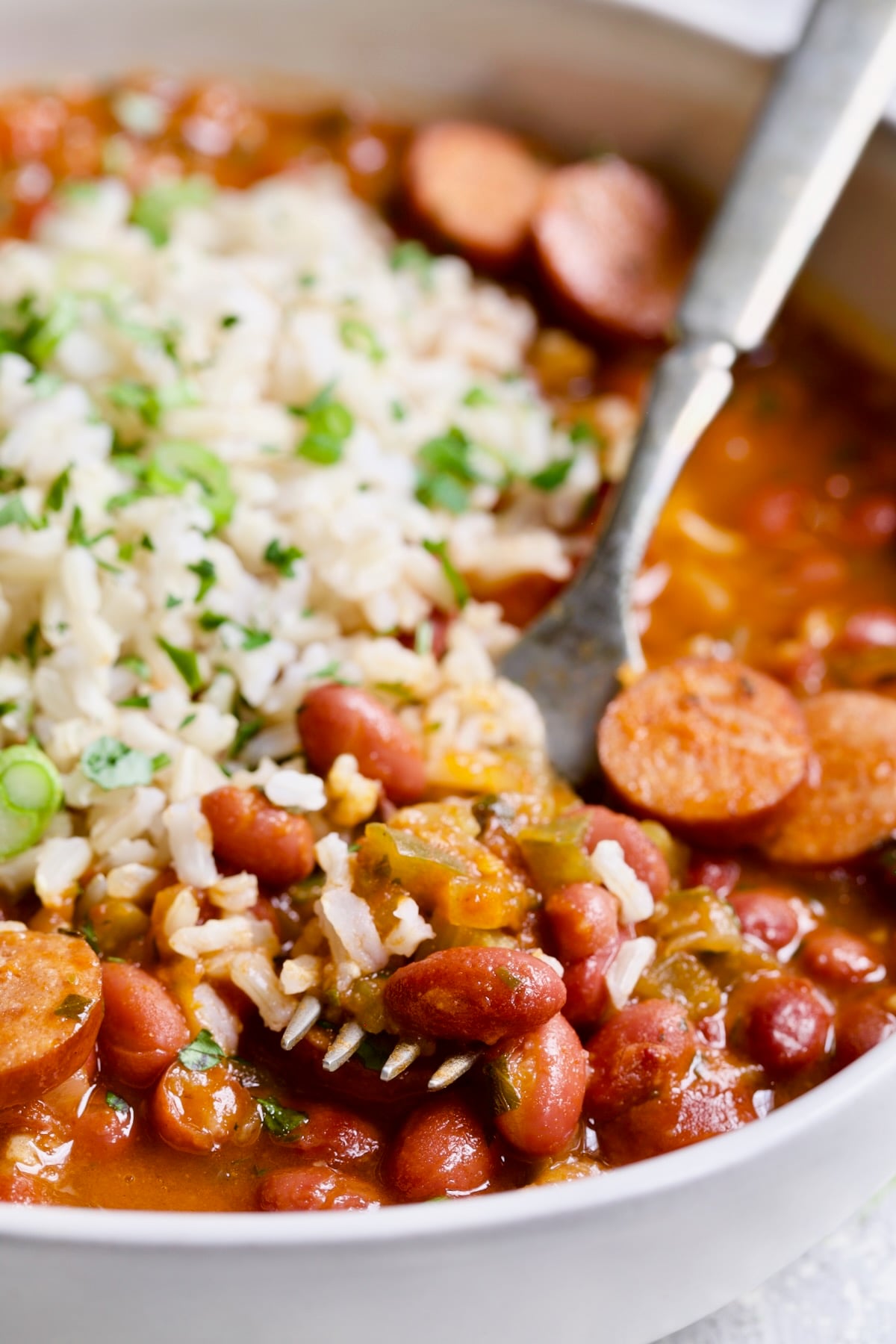 Easy Red Beans and Rice on fork being scooped up.
