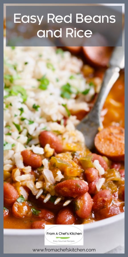 One serving of Easy Red Beans and Rice in white bowl with fork lifting some out.