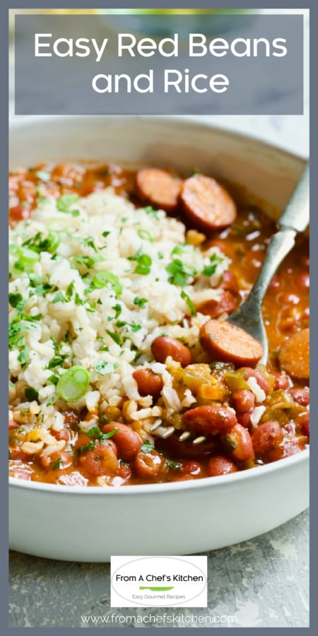 One serving of Easy Red Beans and Rice in white bowl with fork lifting some out.