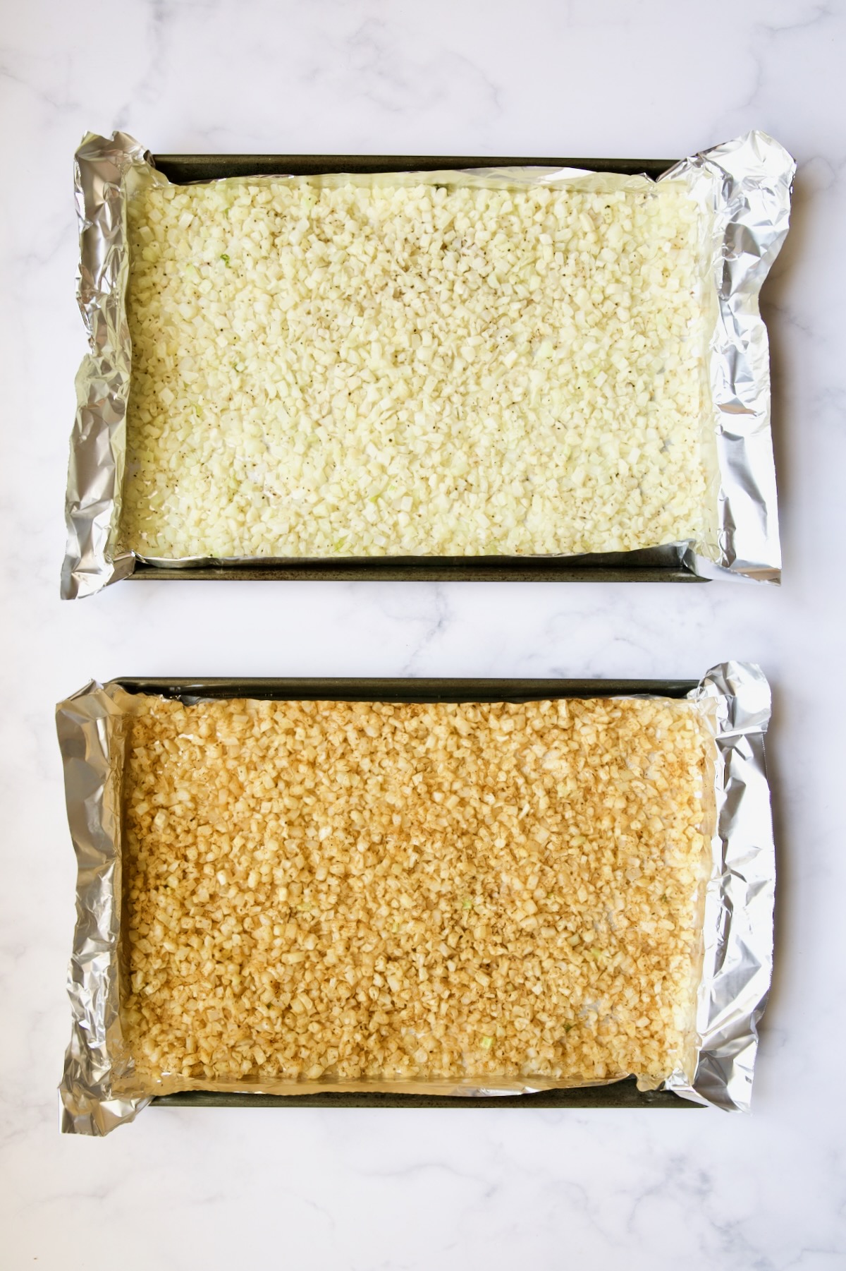 Two sheet pans of cauliflower rice--one unseasoned, the other seasoned.