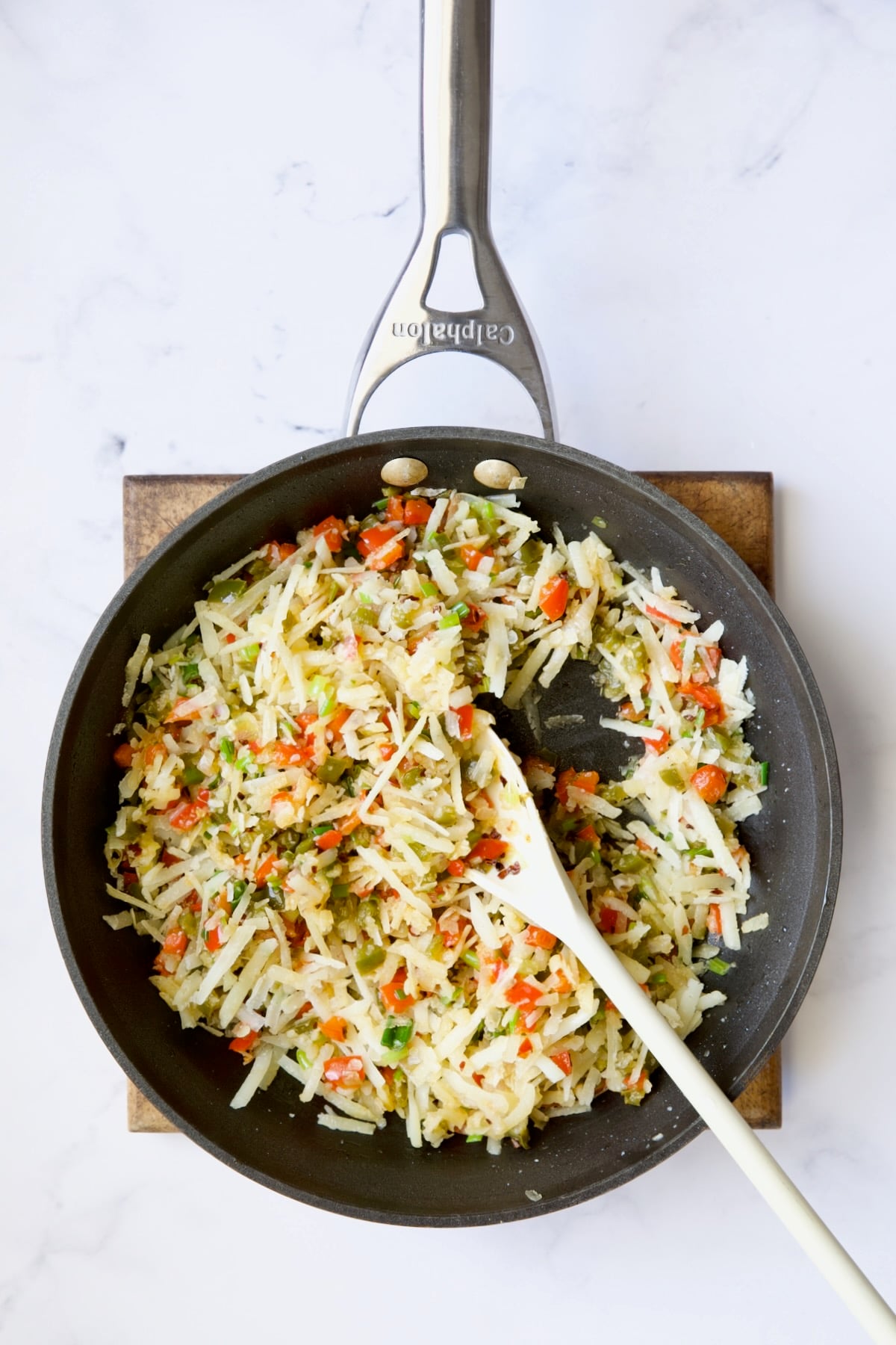 Peppers, onions and cheese in nonstick skillet.