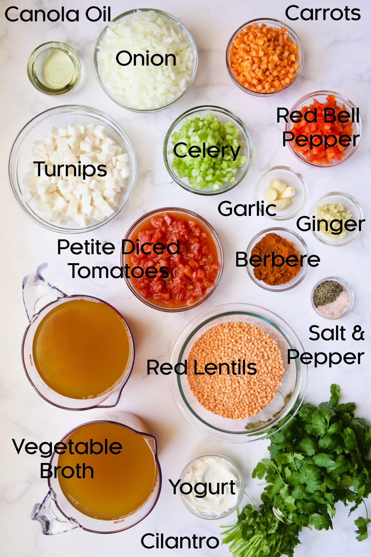Ingredients for Ethiopian Red Lentil Vegetable Soup in glass bowls.