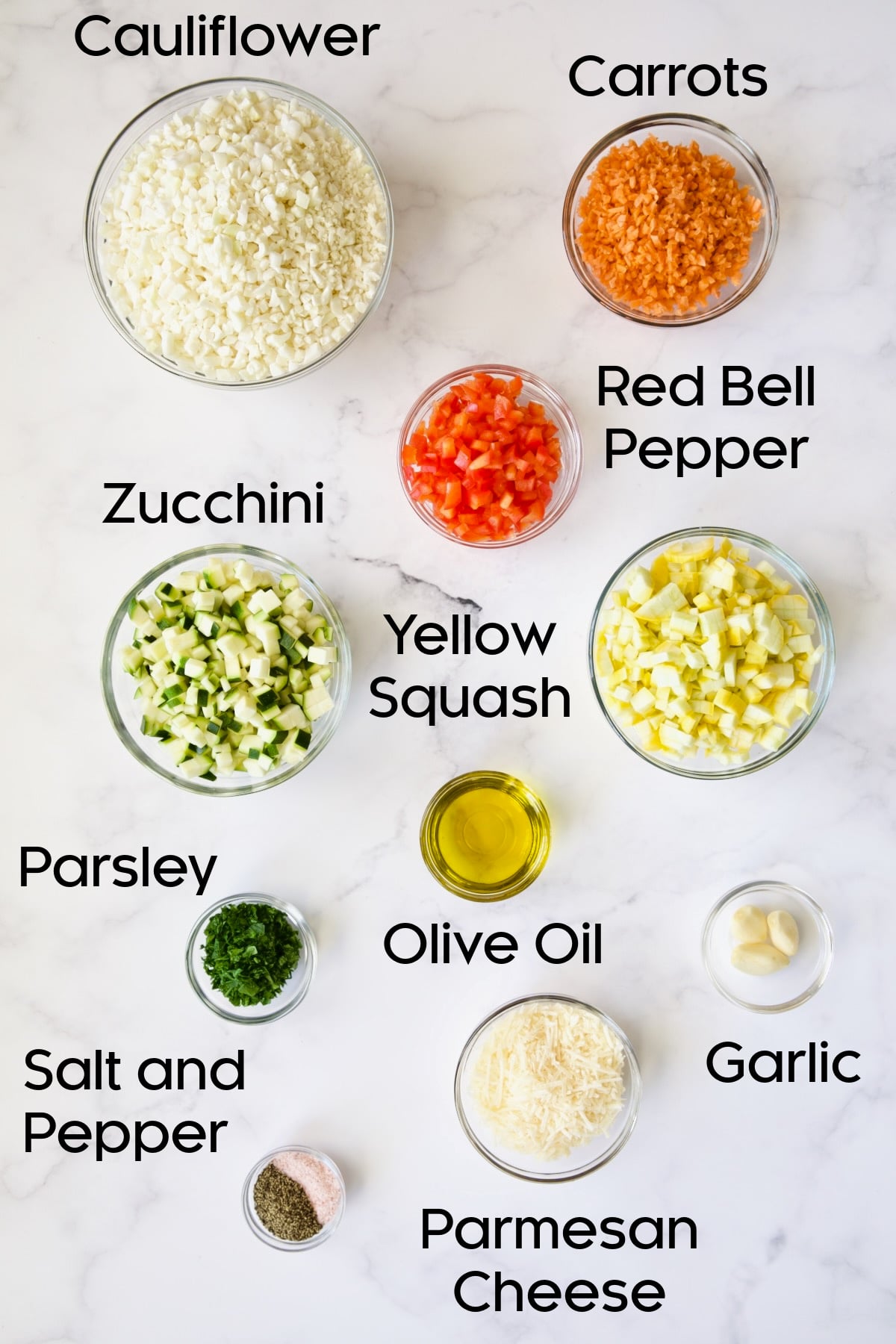 Ingredients for Garlic Parmesan Roasted Vegetable Rice in glass bowls.