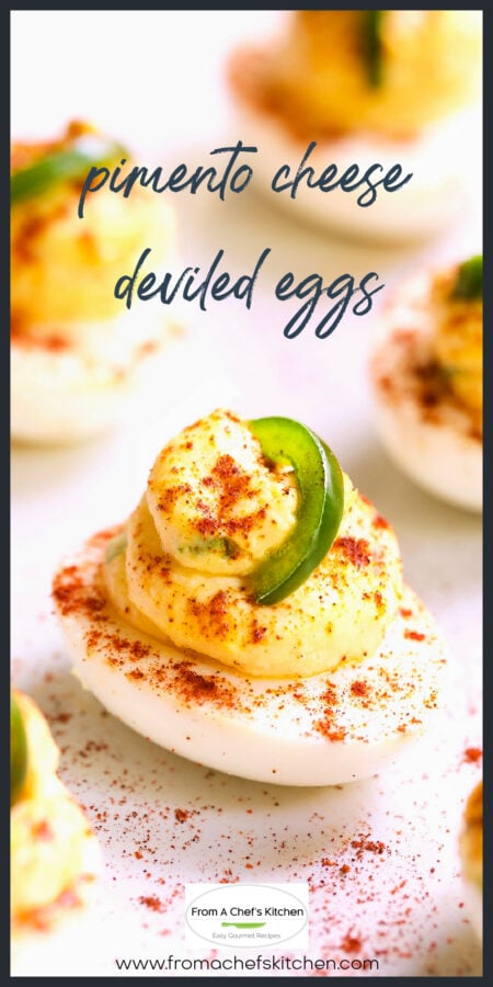 Close-up of Pimento Cheese Deviled Egg on white platter.