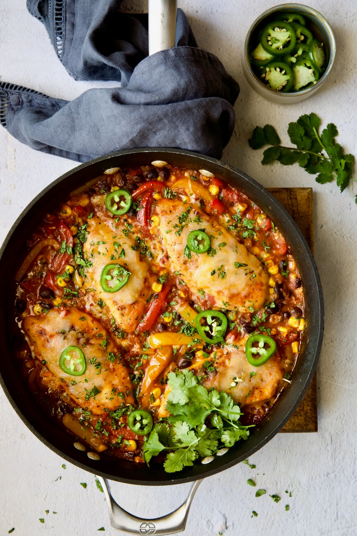 Southwestern Chicken Skillet in the skillet garnished with jalapeno slices and cilantro.