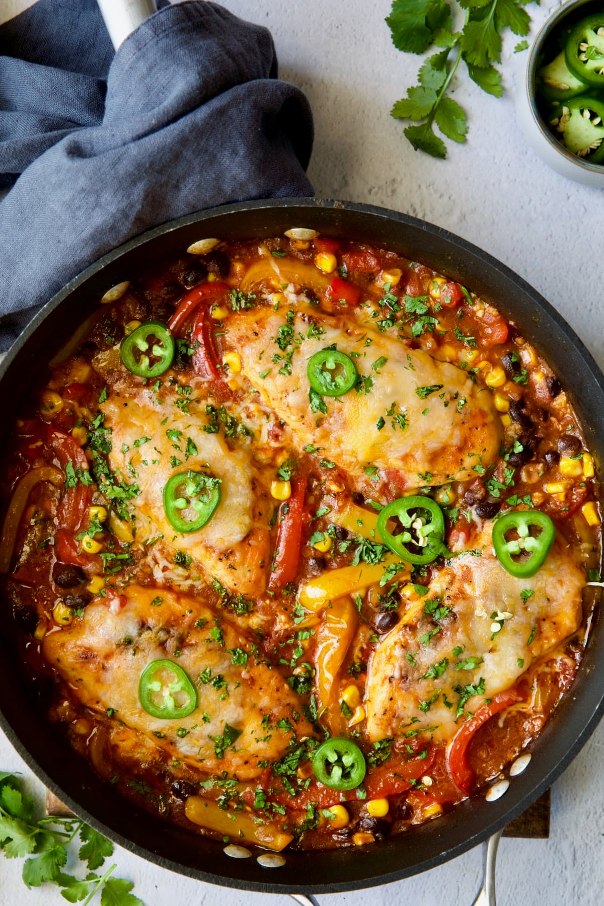 Southwestern Chicken Skillet garnished with jalapeno and cilantro.