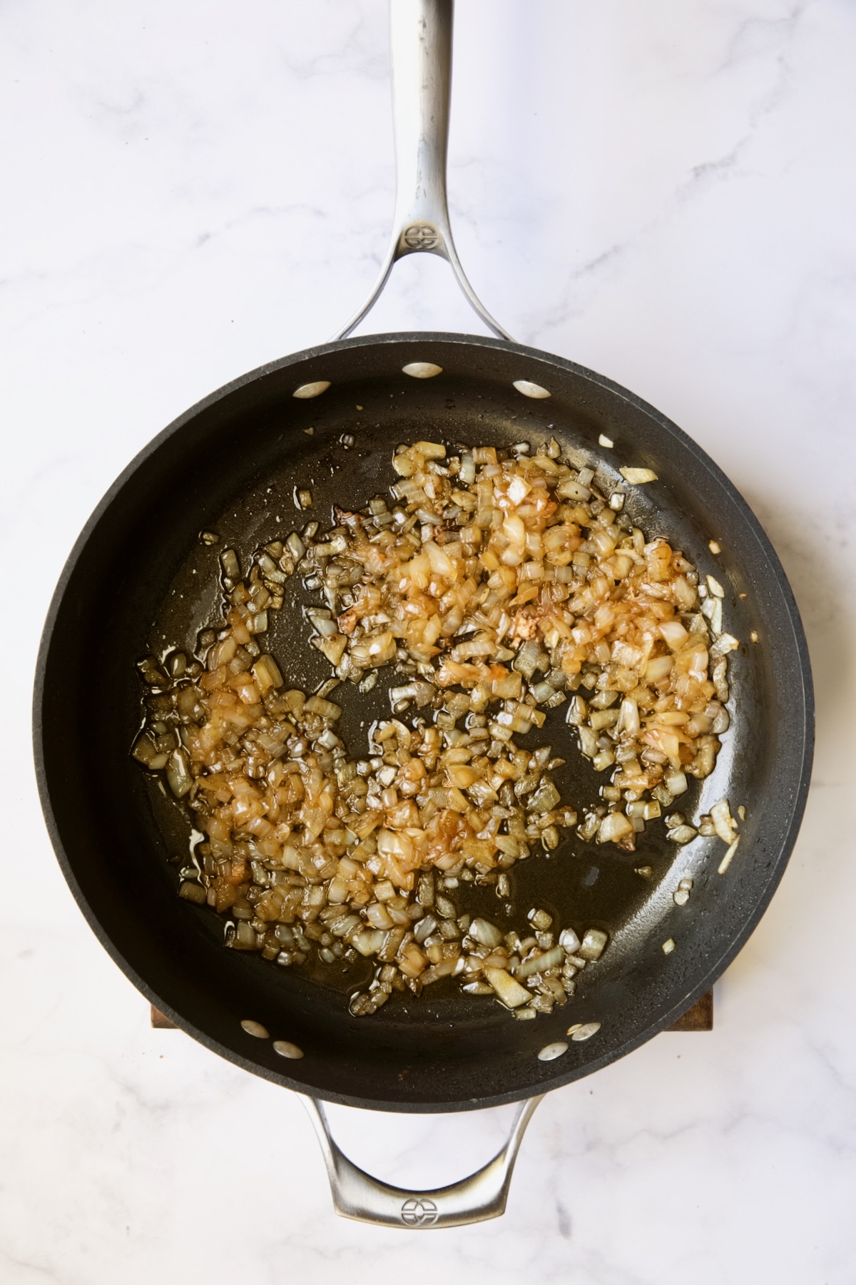 Cooked onions in skillet.