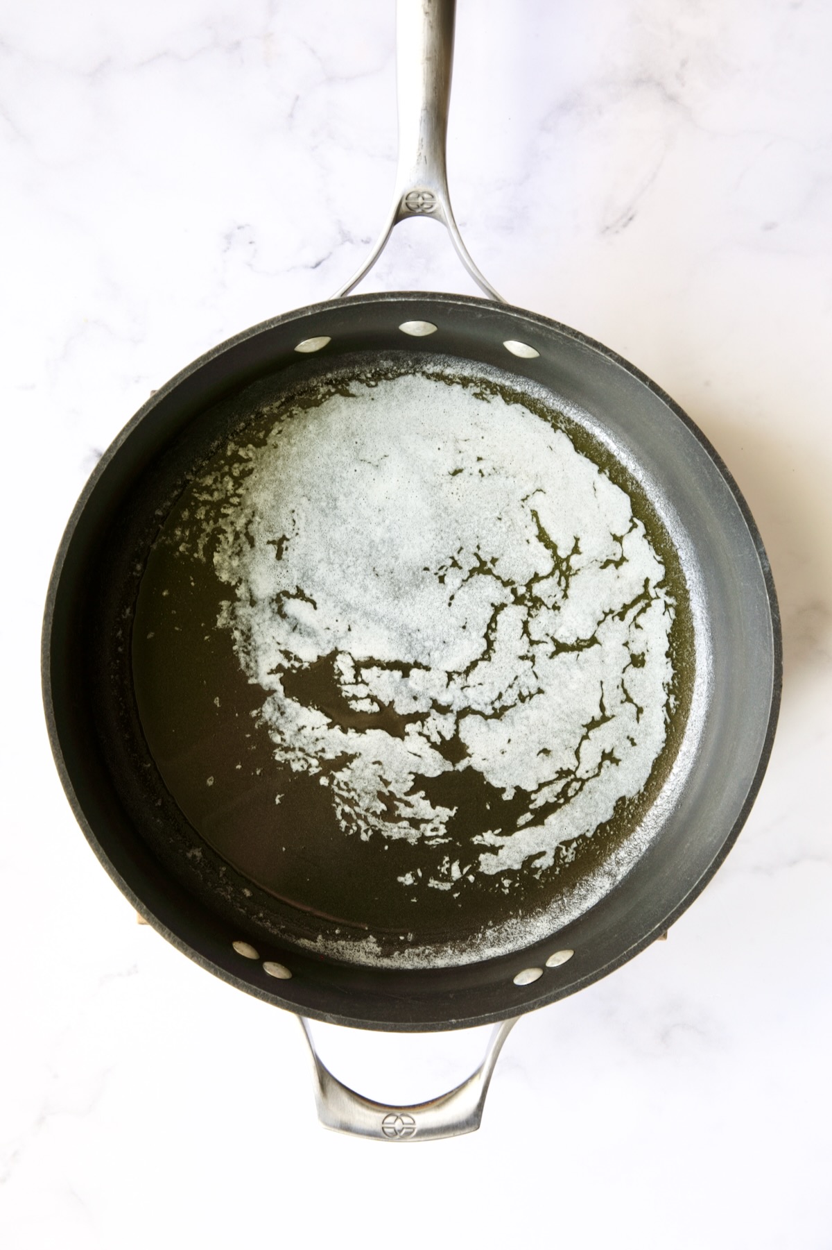 Melted butter in nonstick skillet.