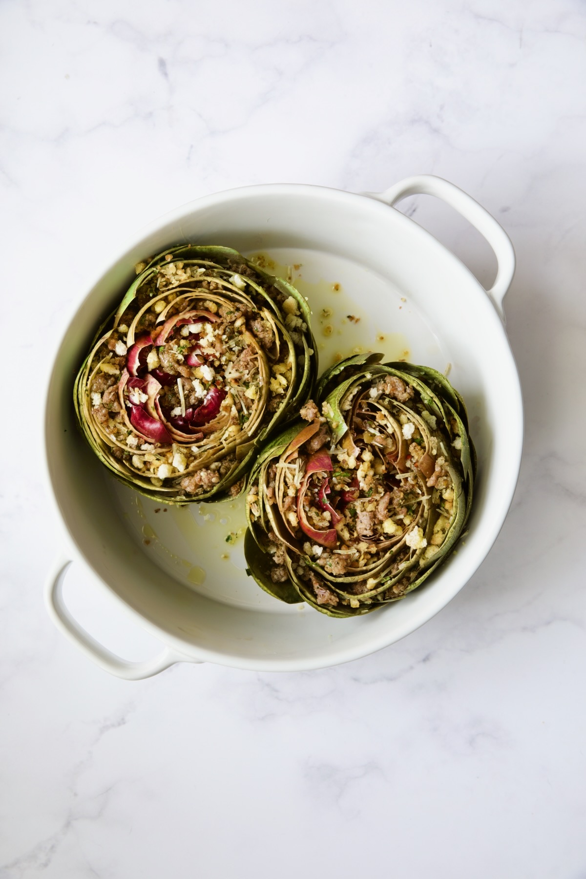 Stuffed artichokes before being baked.