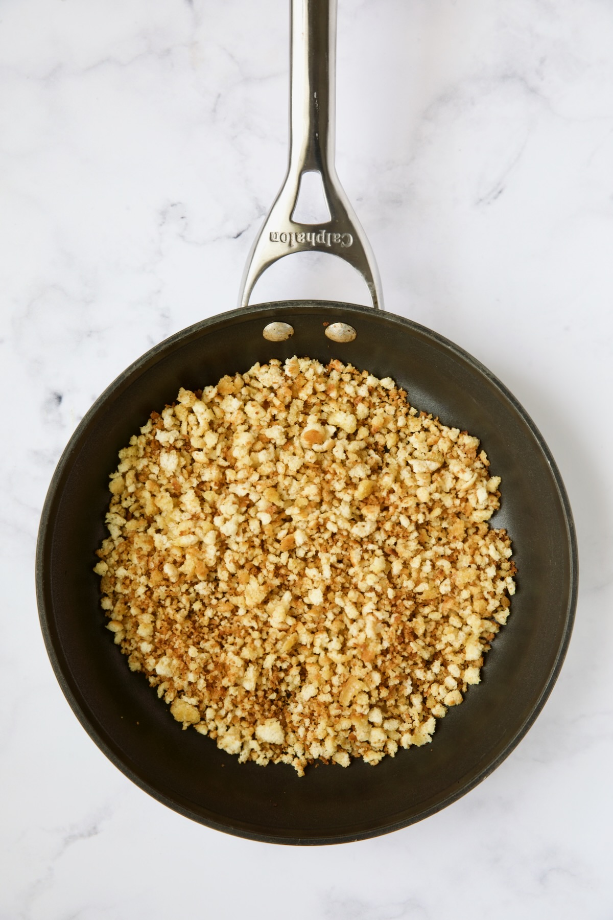 Toasted breadcrumbs in nonstick skillet.
