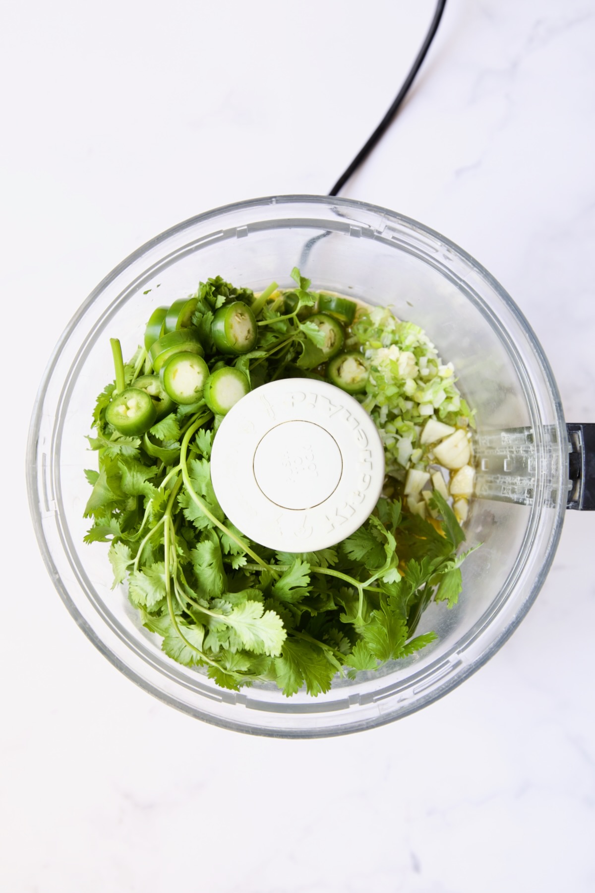Ingredients for Cilantro - Cashew Sauce in food processor before being processed.
