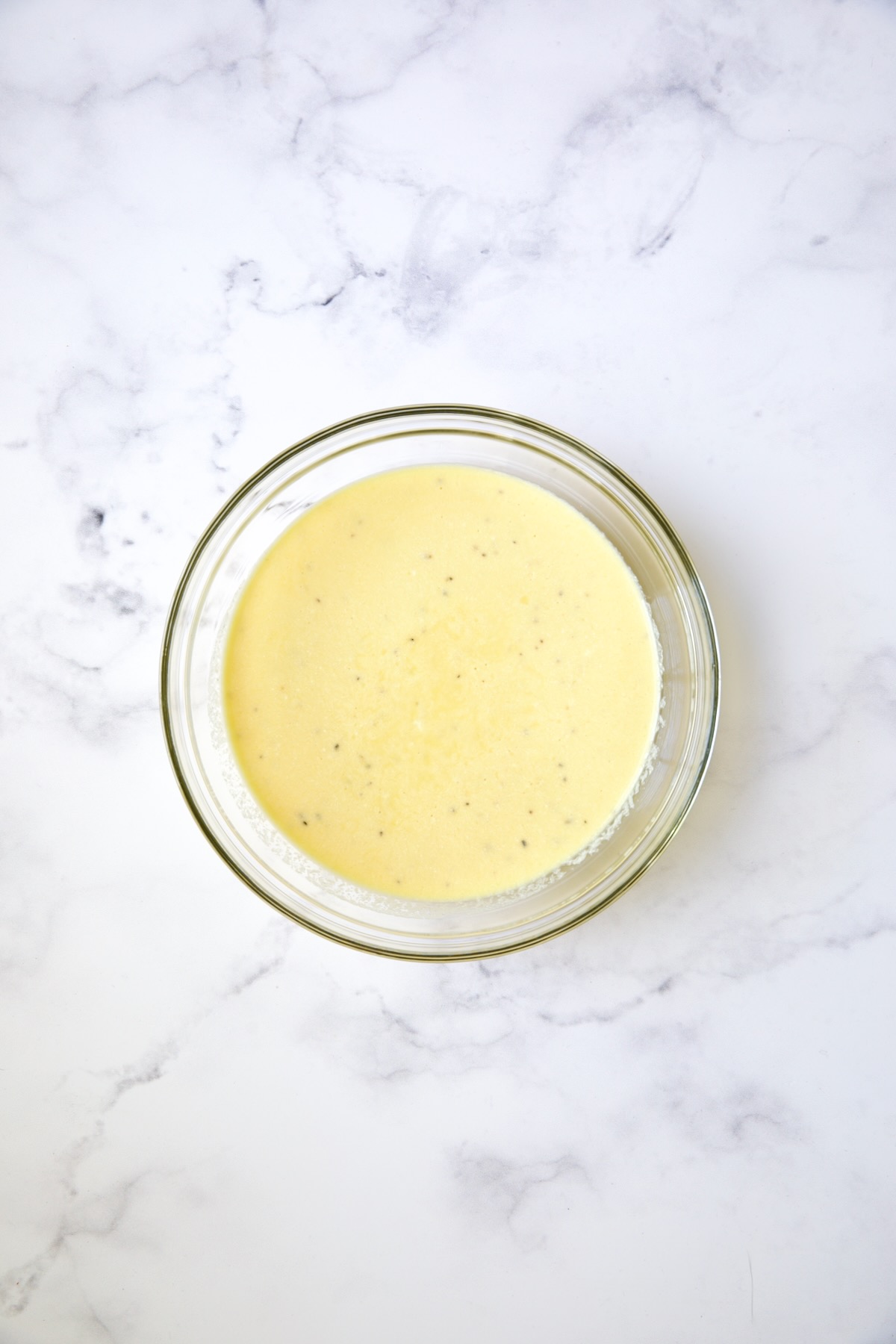 Custard for sheet pan puff pastry tart in glass bowl.