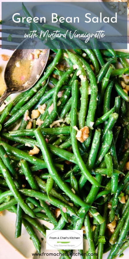 Pinterest graphic for Green Bean Salad with Mustard Vinaigrette with the salad on white platter with serving utensils.