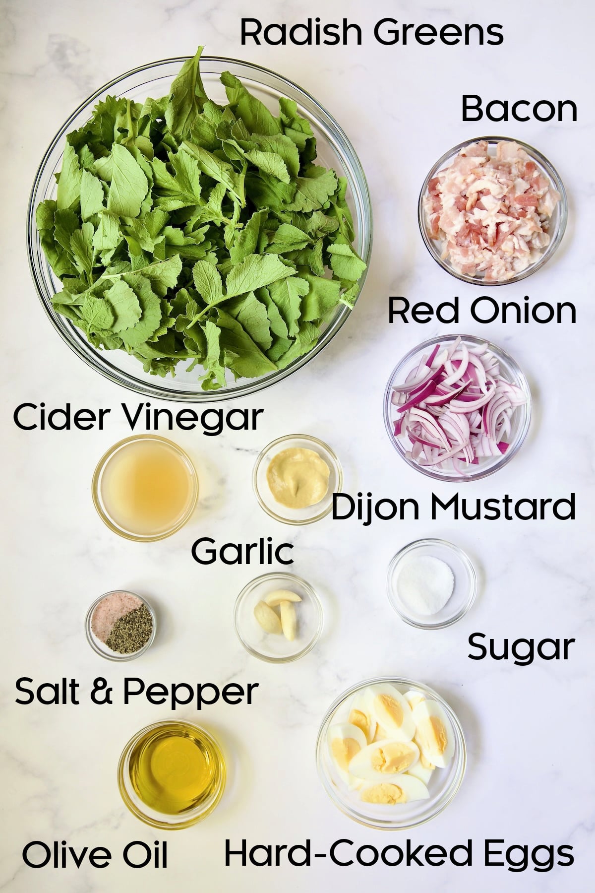 Ingredients for Radish Greens Salad with Hot Bacon Dressing in glass bowls.