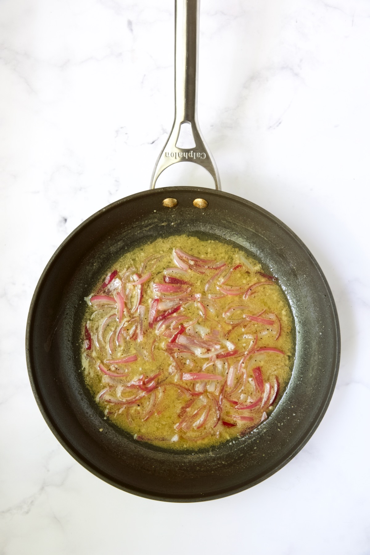 Dressing in skillet with onions.
