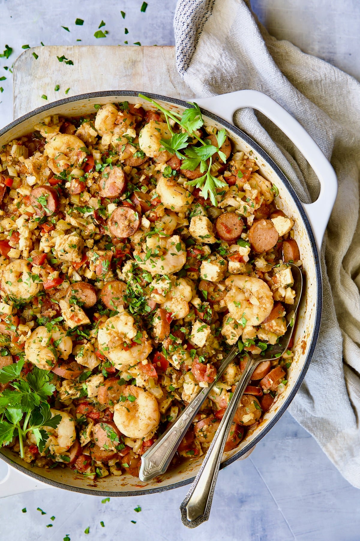 Low-Carb Jambalaya with Chicken, Shrimp and Sausage with serving utensils.