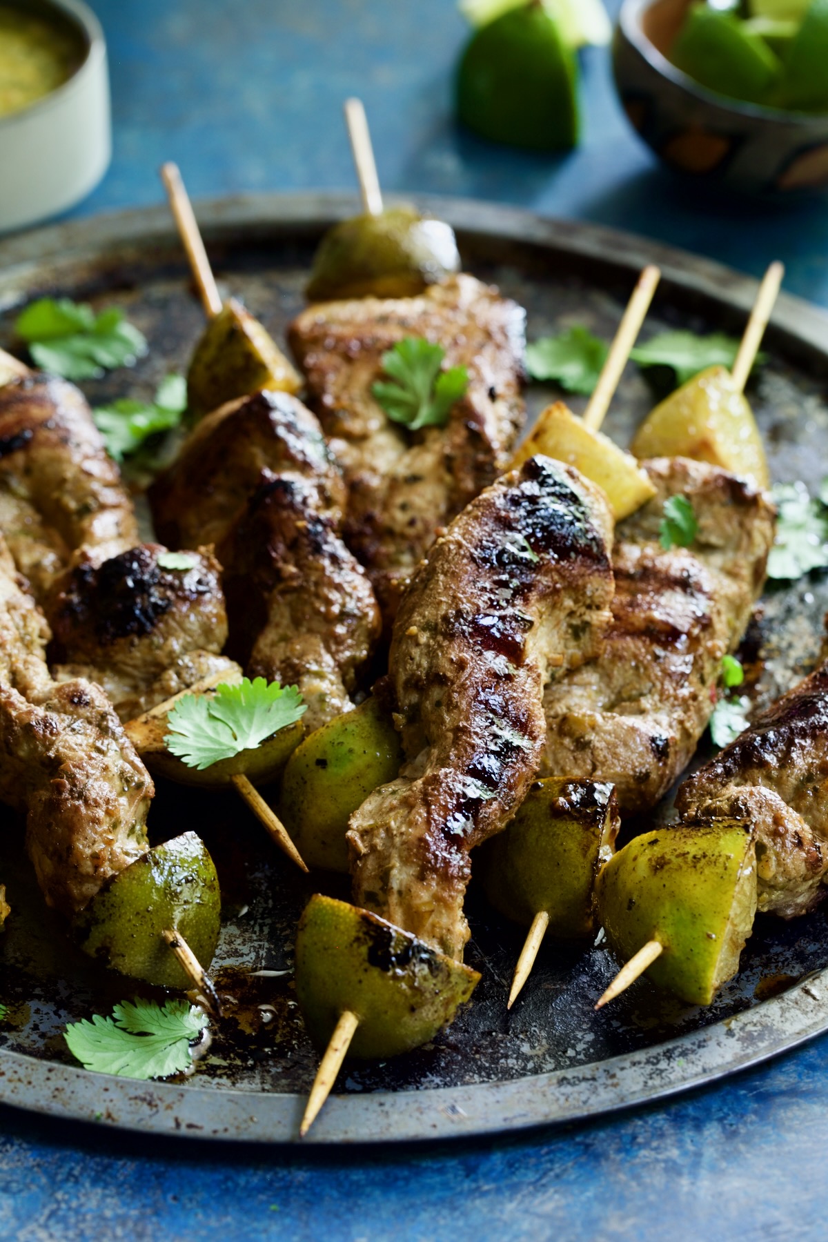 Mojo-Marinated Pork Skewers on metal tray.