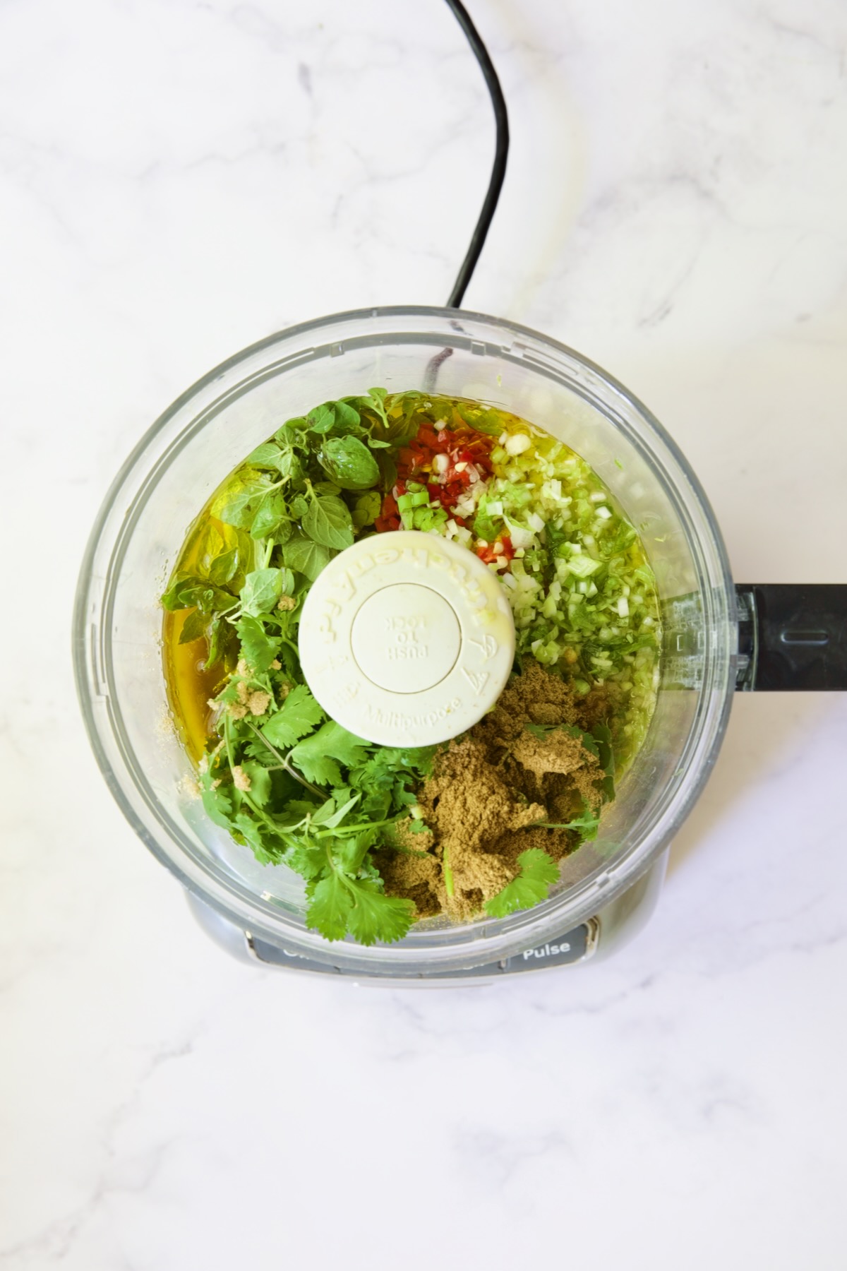Marinade ingredients in food processor before being pureed.