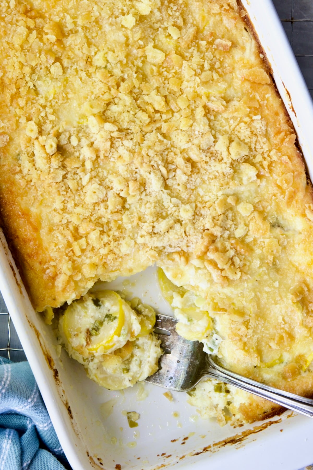 Summer Squash Casserole with a piece removed and squash on serving fork.